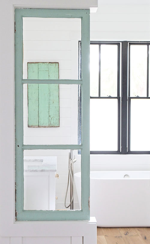 farmhouse bathroom, white walls, freestanding tub, architectural salvage, antique windows, black windows