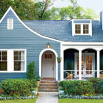 blue cottage house with front porch sherwin williams benjamin moore behr paint