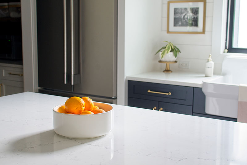 White kitchen, minimalist kitchen, fruit bowl, orange bowl