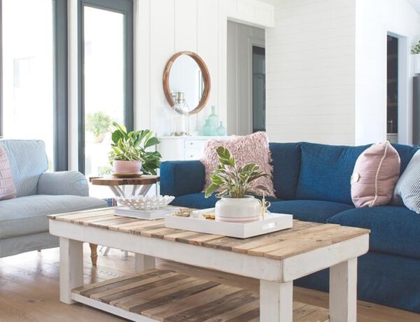 modern farmhouse living room navy blue sofa couch rectangle coffee table armchair ikea board and batten round mirror