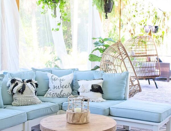 bohemian design, boho style porch, outdoor sectional, pottery barn outdoor sofa, hanging plants, hanging egg chair